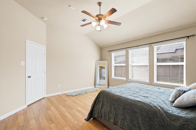 bedroom featuring lofted ceiling, hardwood / wood-style floors, and ceiling fan