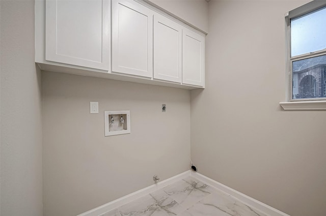 washroom with washer hookup, electric dryer hookup, hookup for a gas dryer, and cabinets