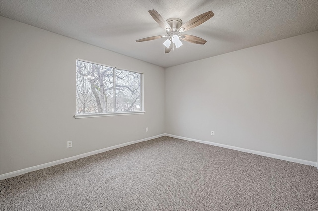 empty room with carpet floors, a textured ceiling, and ceiling fan