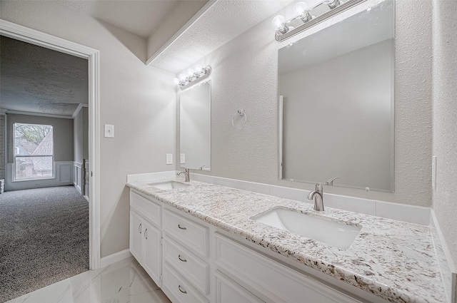 bathroom with vanity and a textured ceiling