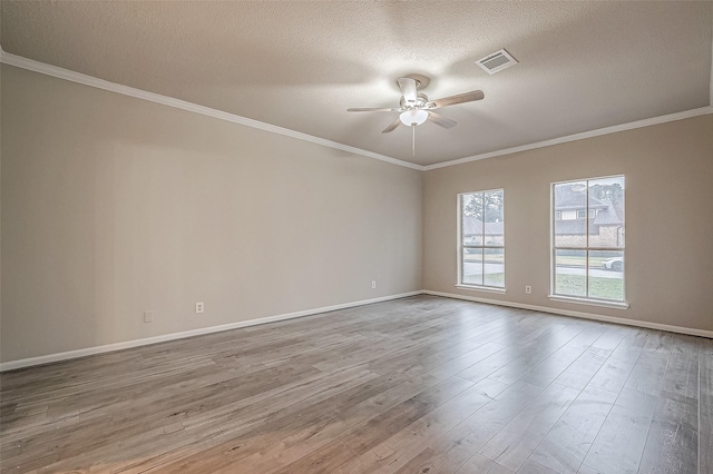 unfurnished room featuring ornamental molding, a textured ceiling, ceiling fan, and light hardwood / wood-style flooring