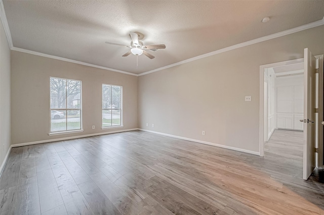 unfurnished room with crown molding, light hardwood / wood-style flooring, and a textured ceiling