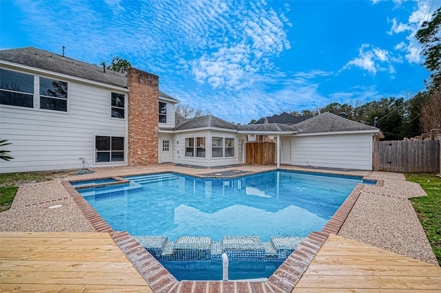 view of swimming pool with a wooden deck