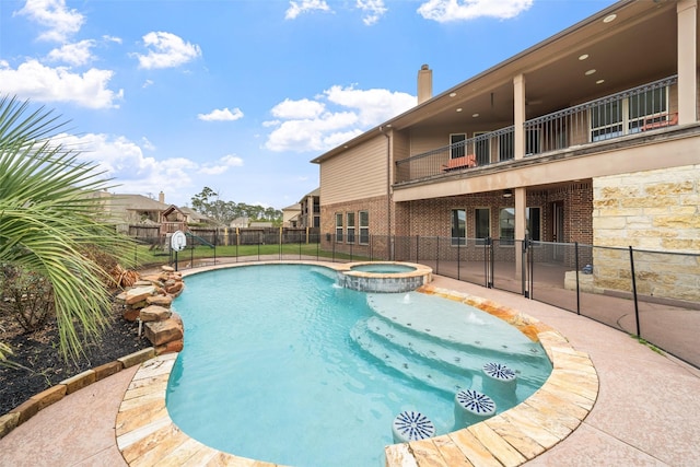 18007 Stari Most Ln, Houston, TX 77044 - view of pool featuring fence, a pool with connected hot tub, and a patio