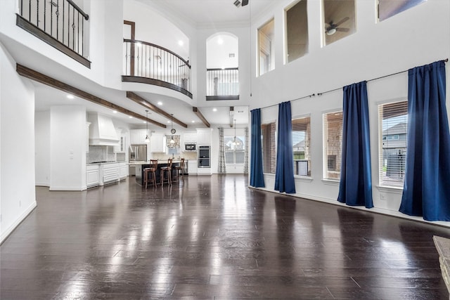 18007 Stari Most Ln, Houston, TX 77044 - living area featuring ceiling fan, dark wood finished floors, a high ceiling, recessed lighting, and baseboards