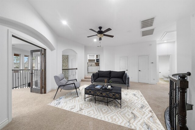 18007 Stari Most Ln, Houston, TX 77044 - carpeted living room featuring attic access, arched walkways, a ceiling fan, recessed lighting, and baseboards