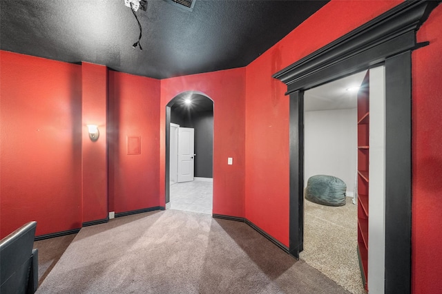 18007 Stari Most Ln, Houston, TX 77044 - carpeted empty room featuring arched walkways and a textured ceiling
