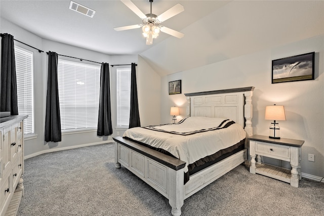 bedroom with light carpet, multiple windows, visible vents, and baseboards