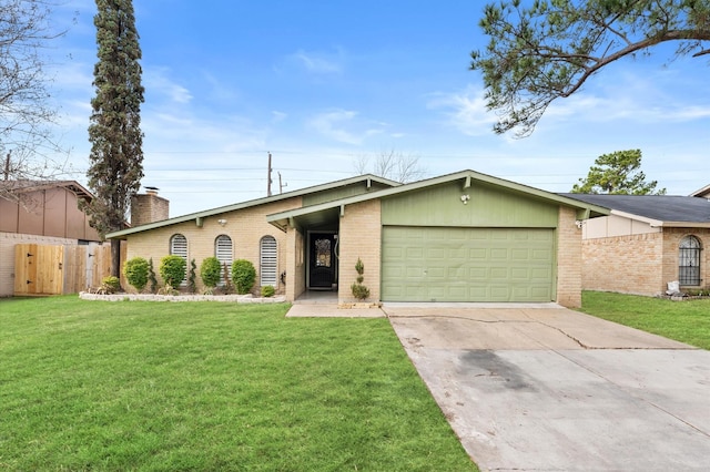 ranch-style home with a garage and a front lawn