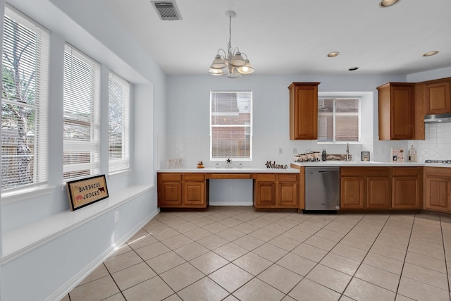 kitchen with hanging light fixtures, backsplash, white gas stovetop, light tile patterned flooring, and stainless steel dishwasher