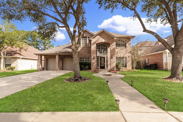 view of front of house featuring a garage, a front yard, and central AC unit