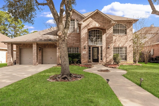 view of front of home featuring a garage and a front yard