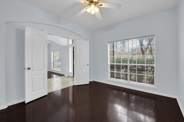 unfurnished room featuring hardwood / wood-style floors and ceiling fan