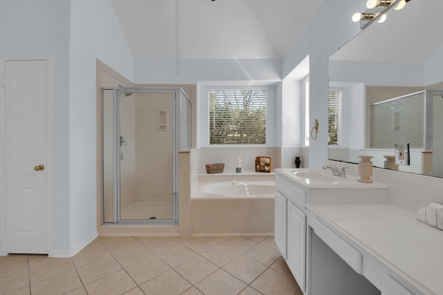 bathroom featuring tile patterned flooring, vaulted ceiling, and shower with separate bathtub