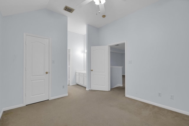 unfurnished bedroom with lofted ceiling, light carpet, and ceiling fan