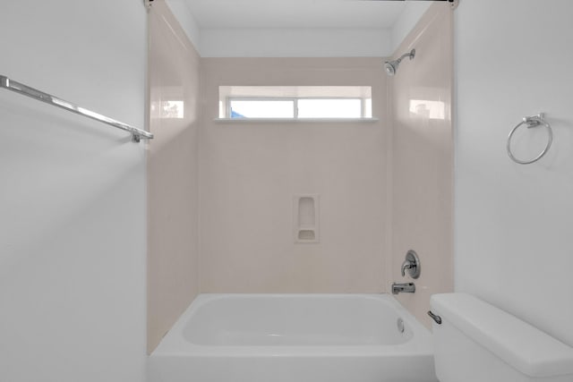 bathroom with shower / tub combination and toilet