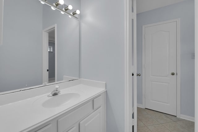 bathroom featuring tile patterned flooring and vanity