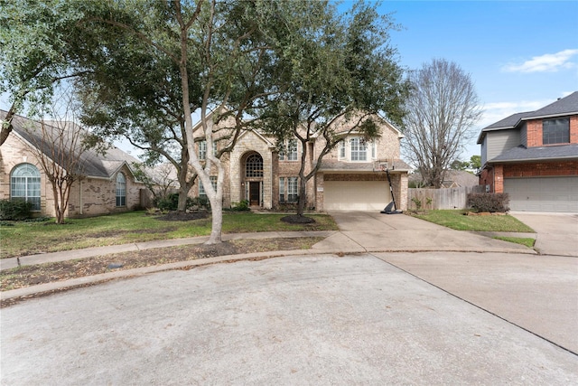 view of front of property featuring a garage and a front yard