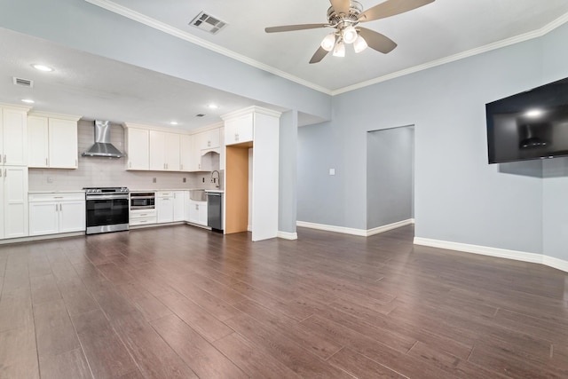 unfurnished living room featuring crown molding, dark hardwood / wood-style floors, sink, and ceiling fan