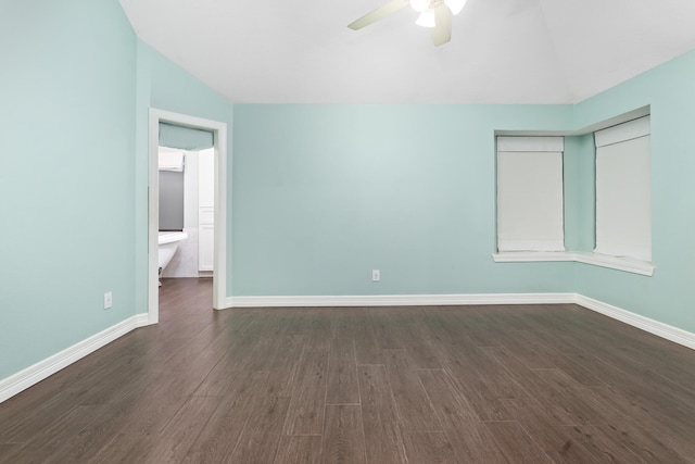 unfurnished bedroom featuring lofted ceiling, dark hardwood / wood-style floors, and ceiling fan