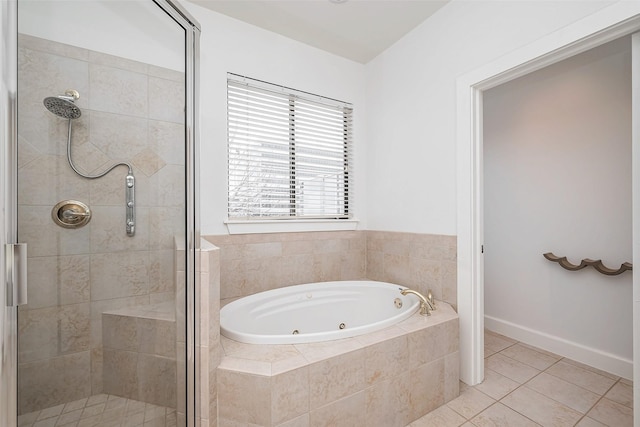 bathroom with baseboards, a jetted tub, a shower stall, and tile patterned floors