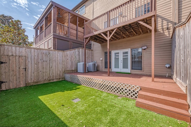 exterior space featuring french doors, central AC, fence, and a wooden deck