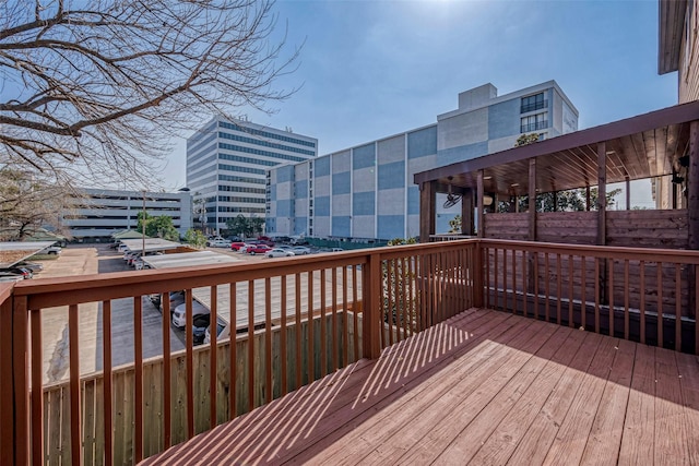 wooden deck featuring a view of city