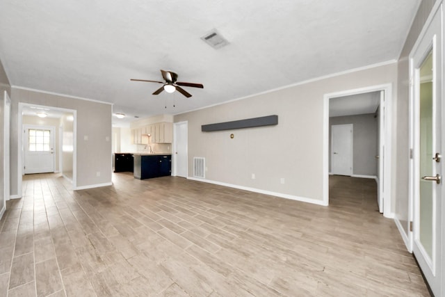 unfurnished living room featuring crown molding, light hardwood / wood-style floors, and ceiling fan