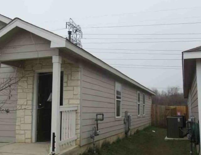 view of side of home featuring central air condition unit