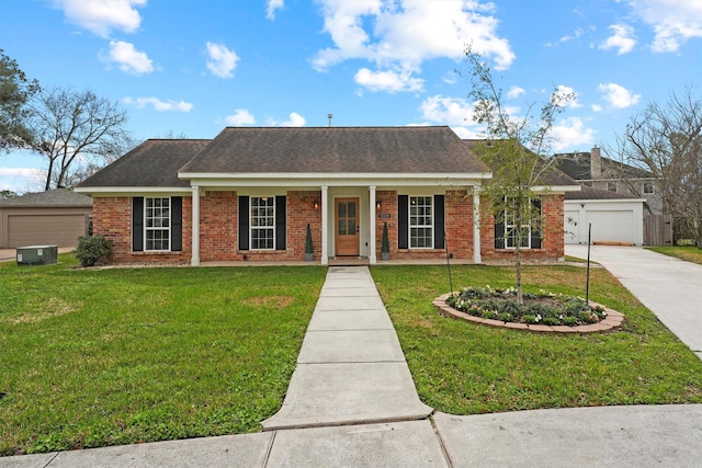 ranch-style home featuring a garage and a front yard