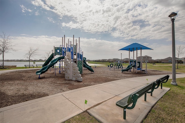 view of jungle gym featuring a water view