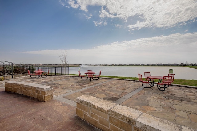 view of patio featuring a water view