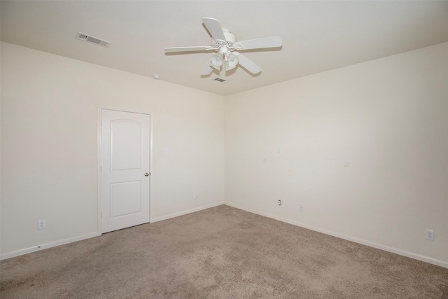 spare room with ceiling fan and carpet flooring