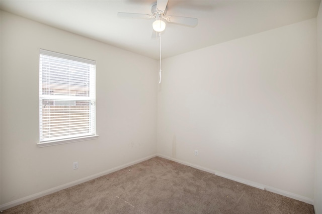 empty room with light colored carpet and ceiling fan