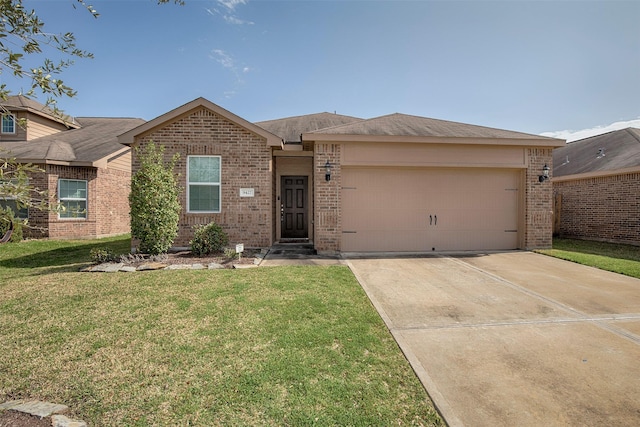 view of front of house featuring a garage and a front yard