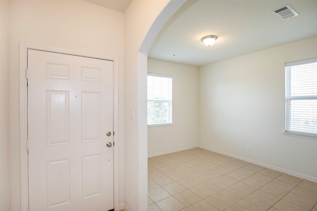 tiled entryway with plenty of natural light