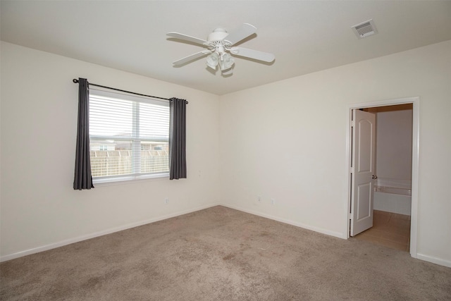 carpeted empty room with ceiling fan