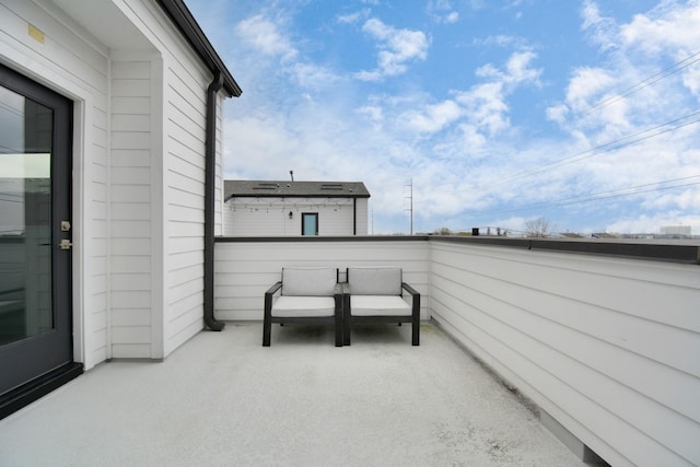 view of patio featuring a balcony