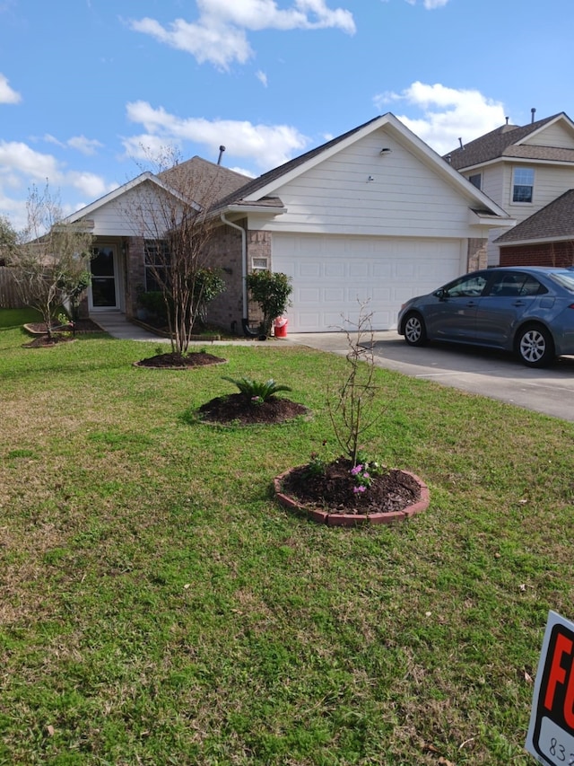 view of front of home featuring a garage and a front yard