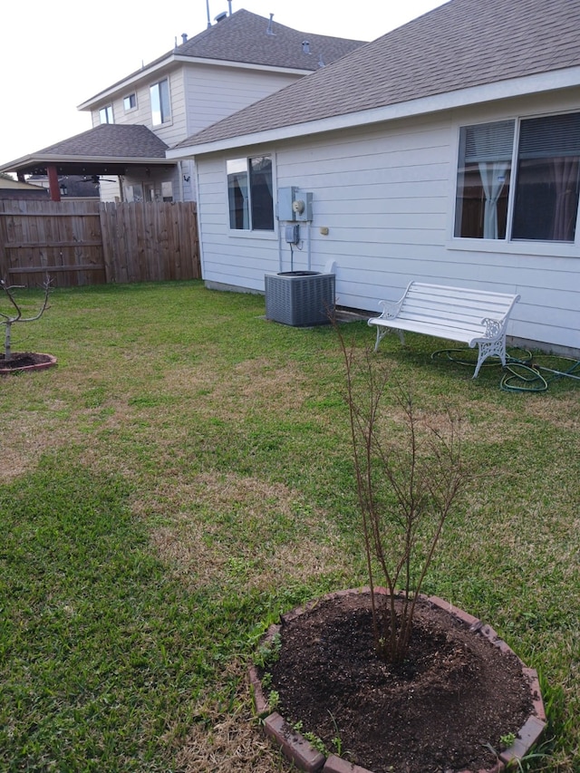 view of yard with central AC