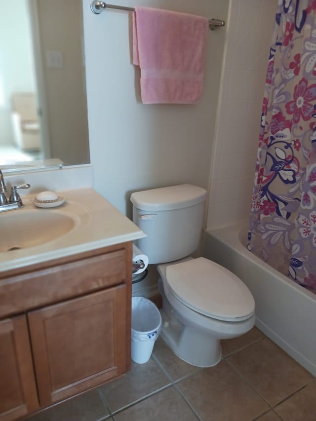 full bathroom with vanity, tile patterned flooring, shower / bath combination with curtain, and toilet