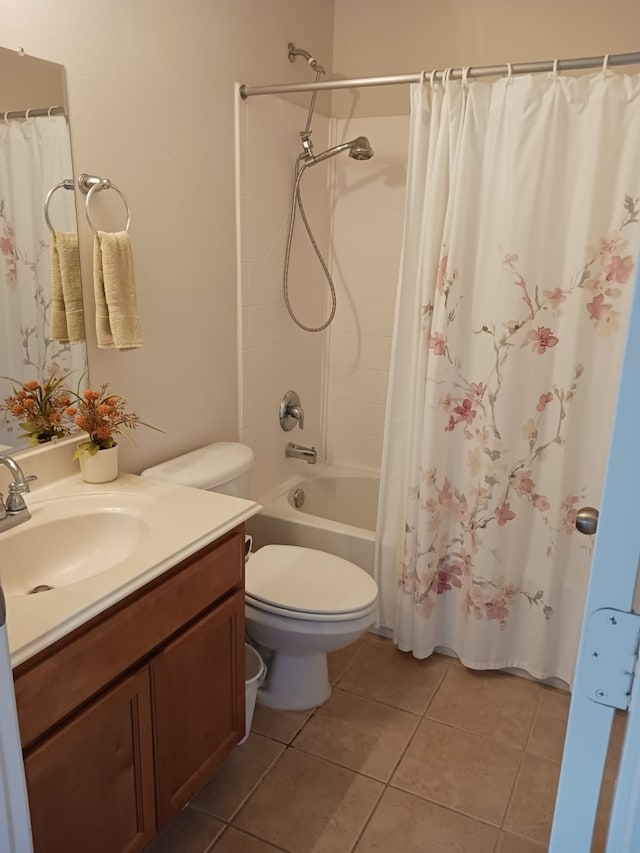 full bathroom with tile patterned floors, toilet, vanity, and shower / bath combo