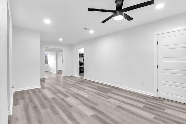 unfurnished room featuring ceiling fan and light hardwood / wood-style flooring