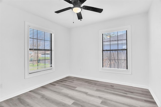 unfurnished room featuring ceiling fan and light hardwood / wood-style flooring