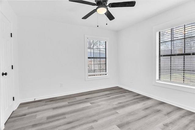 unfurnished room with ceiling fan and light wood-type flooring