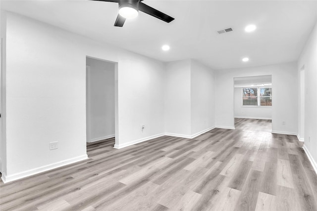 spare room featuring ceiling fan and light wood-type flooring