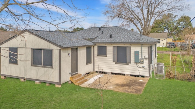 back of house featuring cooling unit, a yard, and a patio area