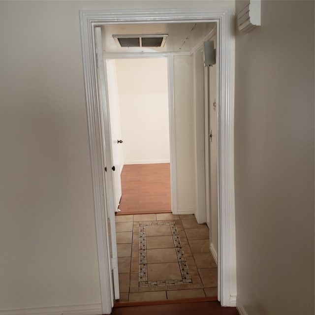 corridor with light hardwood / wood-style flooring