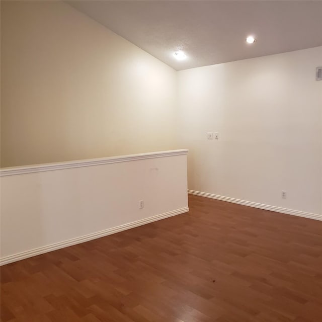 spare room featuring dark hardwood / wood-style floors