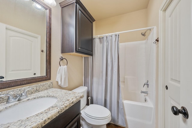 full bathroom with vanity, shower / bath combination with curtain, and toilet